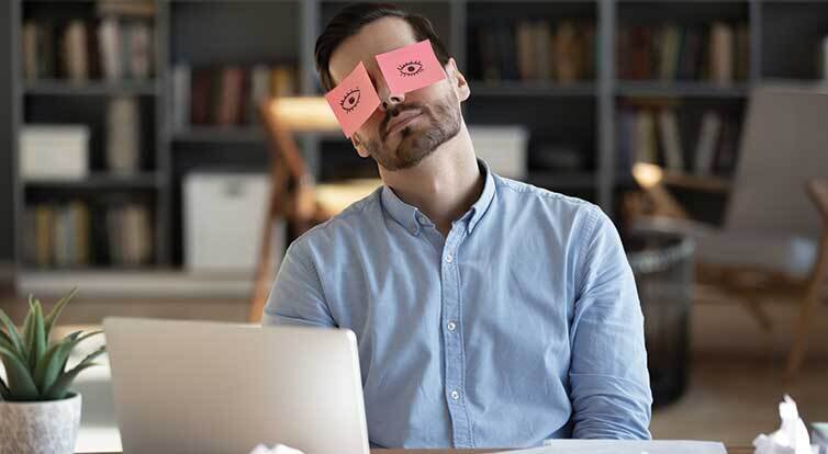 man with post it notes over his eyes
