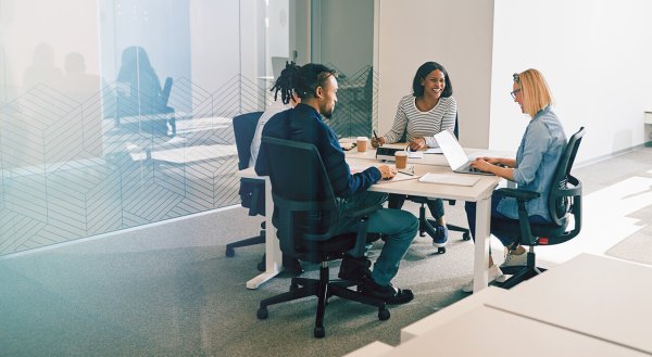 four people working around a table