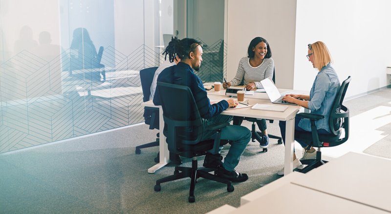 four people working around a table