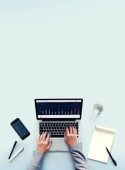 hands typing on a laptop computer