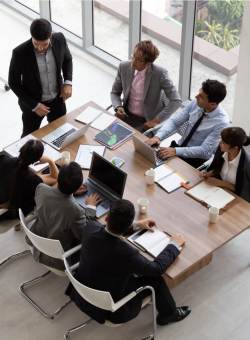 business meeting around wooden table