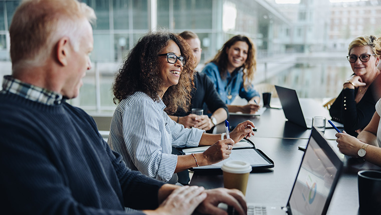 casual business people around conference table