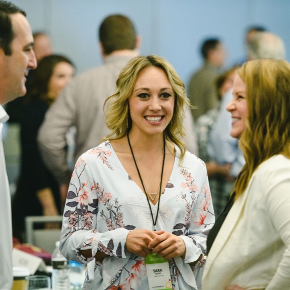 people talking at business conference