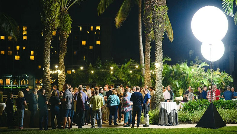 outdoor party with palm trees