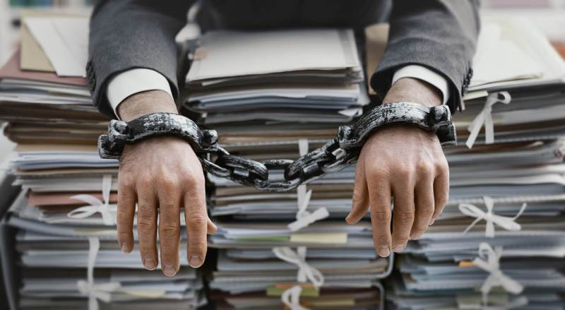 man imprisoned by file folders