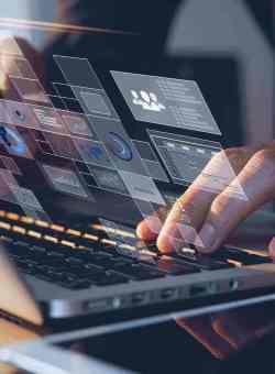 typing on a laptop computer
