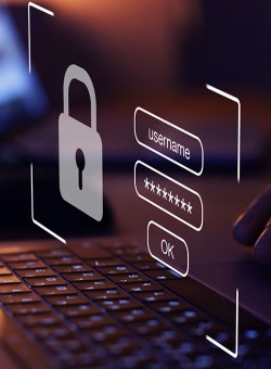 Image of a laptop in a dark room, with a heads-up display showing an password form.